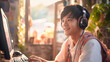 © ImageFlow - Asian man gamer playing in cyber sport tournament online. Ai generative