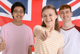 Fototapeta Londyn - Young students of language school against UK flag