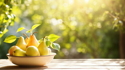 Pears in a ceramic bowl on a wooden table drenched in sunshine against a blurred garden backdrop