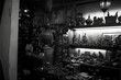 old dingy shop was dimly lit and cramped with shelves upon shelves of trinkets and baubles lining the walls single set of objects which was perched on a velvetdraped pedestal in the center of the 