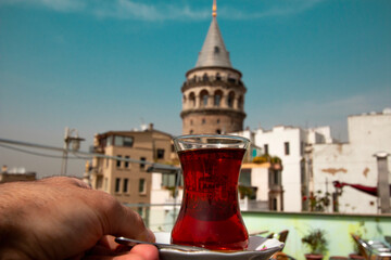 Wall Mural - Drinking Turkish tea with the view of Galata Tower.
