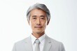 正面の日本人の男性シニアビジネスマンのポートレート写真（白背景・サラリーマン・スーツ・年配・社長・課長・部長・役職）