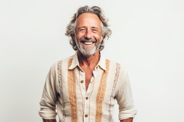 Wall Mural - Portrait of a happy senior man smiling and looking away over white background