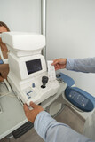 Fototapeta Miasta - Eye specialist printing comprehensive eye examination results