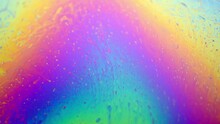 Close-up Macro Of Colorful Iridescent Moving Soap Film Surface, Vibrant Rainbow Colored Pattern And Texture Background