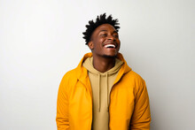 Man With Yellow Jacket Laughing And Looking Up.