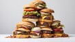 A tower of hamburgers with cheese and lettuce