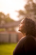 © Austockphoto - Portrait of Aboriginal woman in backyard