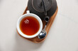 © Austockphoto - Fresh cup of tea served on table