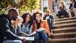 © Dirk - stockphoto, students, bonding or university stairs on college campus for group study, diversity class break. Students of different background and ethnicity sitting on stairs of the university