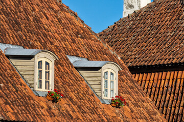 Wall Mural - Old, historical red tiled roof and window, Kuldiga, Latvia.