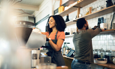 Wall Mural - Happy woman, barista and coffee at cafe for service, beverage or preparation by counter at store. Female person, team or waiter making espresso, cappuccino or latte at restaurant or retail shop