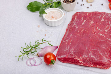 Wall Mural - Dry aged Bavette steak with traditional spices and herbs. Fresh raw meat cut, light stone background