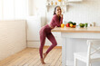 Fitness Woman Posing Near Dining Table At Home Kitchen Interior