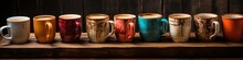 A row of coffee mugs sitting on top of a wooden table. Panoramic banner.