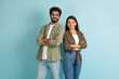 © Prostock-studio - Smiling millennial eastern man and woman standing back to back