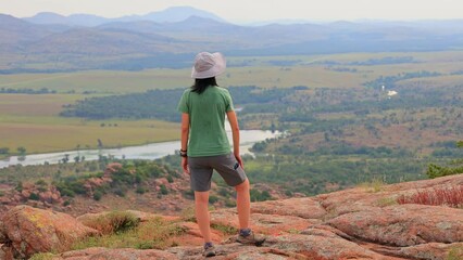 Wall Mural - Woman hiking in the Elk Mountain Trail of the Wichita Mountains National Wildlife Refuge