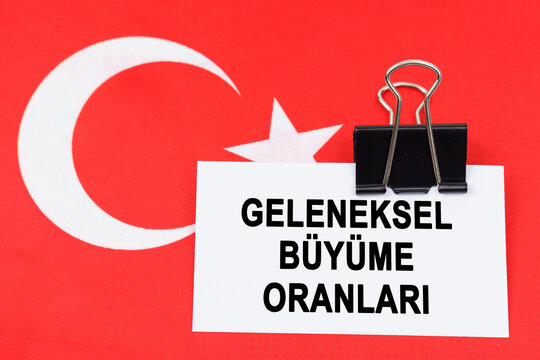 On the flag of Turkey lies a business card with the inscription - traditional growth rates