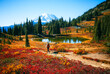 Girl hiking Through In The Chinook Pass Area of Mount Rainier National Park at Fall, Naches Peak Loop Trail