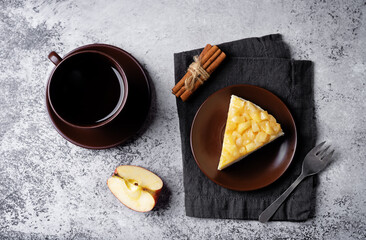 Wall Mural - Cheesecake with caramelized cinnamon apple slices in a plate