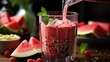hand pouring healthy watermelon smoothie from blender jar into glass on wooden table