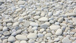 Closeup of a smooth exposed aggregate concrete, revealing its smooth and polished surface with hints of embedded stones and pebbles.