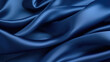 Closeup of a deep sapphire blue satin, its surface resembling a calm ocean on a sunny day. The material is lightweight and smooth, perfect for creating flowy and graceful pieces.
