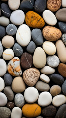 Wall Mural - Closeup of a pebble stone boasting a mix of round and ovalshaped pebbles, arranged perfectly like a puzzle with no gaps in between.