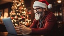 Excited Man In Santa Hat Shopping Online On Laptop