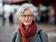 Beautiful and elegant old mixed race woman with gray hair outdoors. Concept about seniority and lifestyle