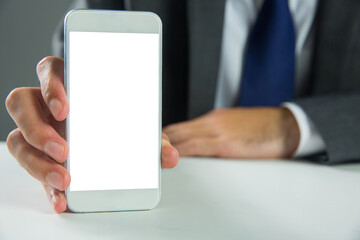 Poster - Digital png photo of man's hand holding smartphone with copy space on transparent background