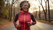 Beautiful black senior lady jogging with enthusiasm and energy