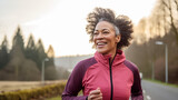 Fototapeta  - Beautiful black senior lady jogging with enthusiasm and energy