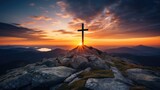 Fototapeta Krajobraz - Christian cross in the peak of a mountain at sunset.