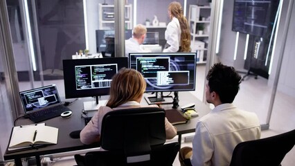 Computer Programmer Writing Program Code On Computer