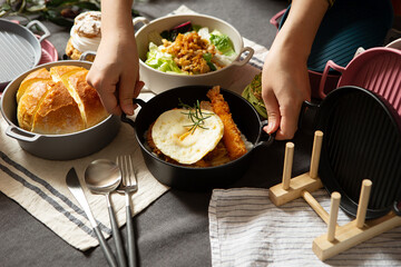 Canvas Print - Various foods on the table, hands holding food