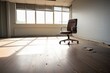 a vacant office space with a single rolling chair