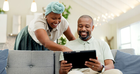 Canvas Print - Black couple, laughing and tablet on a home sofa for streaming, meme and internet in a living room. African woman and man together to talk about tech, funny post or video on social media or network