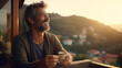 A Hispanic man in his 40s with a goatee sitting on a balcony in Spain, morning time, drinking coffee, beautiful sunrise, copy space - Generative AI