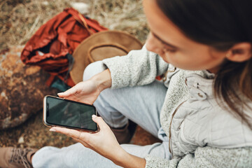 Poster - Woman, hands and phone screen on camp for social media, navigation or outdoor communication in nature. Closeup of female person with mobile smartphone display, app or mockup for networking or search