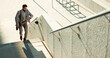 © N F/peopleimages.com - Business, city and man on the stairs, late and running with appointment, schedule and stress. Person outdoor, professional or employee check time, steps or travel with worker, rush or speed to office