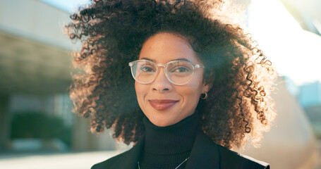 Poster - Face, city and woman with glasses, business and smile with professional, lens flare and career. Portrait, happy person and entrepreneur with eyewear, sunshine and clear vision with employee outdoor