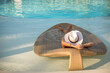 Poolside Paradise: Woman Sunbathing on a Luxury Sunbed