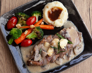 Canvas Print - Pork shoulder steak with mushroom sauce, mashed potatoes and grilled vegetable