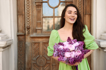 Sticker - Beautiful woman with bouquet of spring flowers near building outdoors, space for text