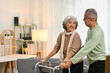 © Prathankarnpap - Supportive senior husband helping his wife walking with walker for rehabilitation and therapy