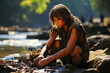 Captivating Cromagnon teenager skillfully crafting tools by a roaring river amidst dense wilderness.