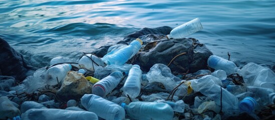 Wall Mural - sea floor pollution caused by plastic bottles and bags with copyspace for text