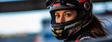 Fototapeta  - A close-up of a female racer wearing a safety helmet.