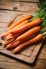 Sticker - Fresh carrots on wooden table.